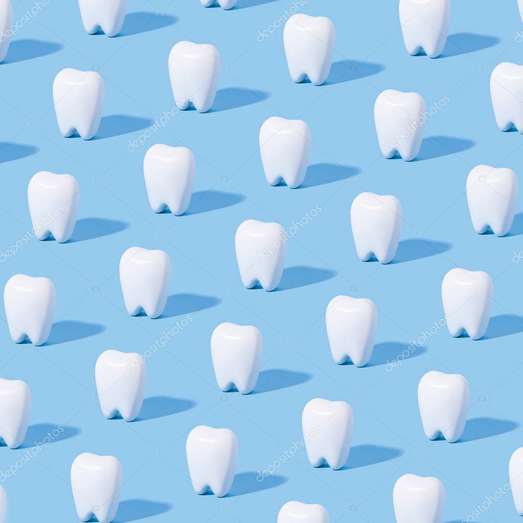 White teeth pattern on a blue paper background.