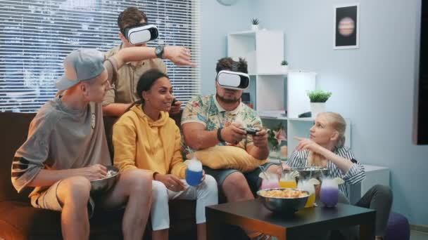 Handsome boys playing online game in virtual reality glasses, one guy wins the battle — Stock Video