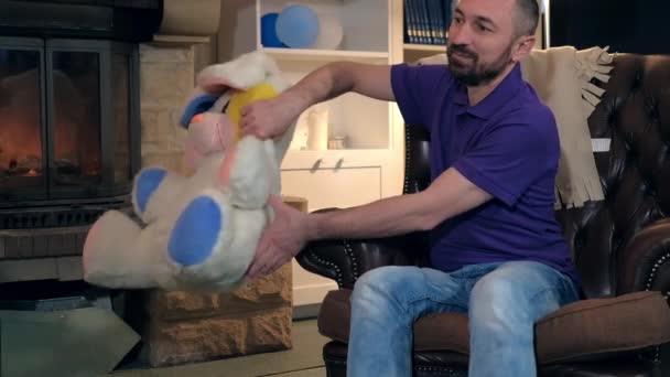 Happy dad giving a plush toy and embracing his little princess — Stock Video