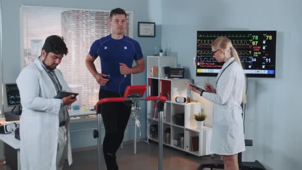 Exhausted athlete suddenly interrupt treadmill test because of feeling bad — Stock Video