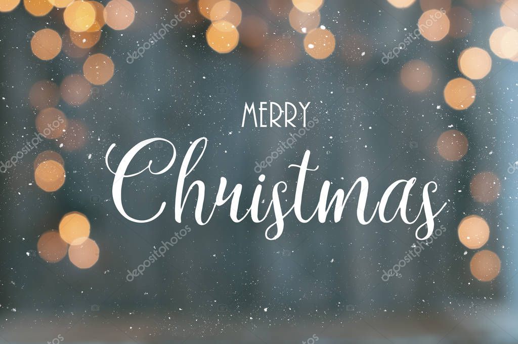 Greeting card merry christmas with defocused christmas lights as background