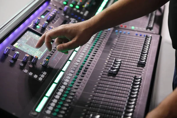 Working with modern digital sound mixing console. Selective focus.
