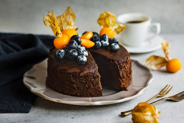 Chocolate cake with Blueberries and Gooseberry on top — Stock Photo, Image