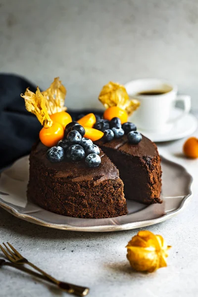 Chocolate cake with Blueberries and Gooseberry on top — Stock Photo, Image