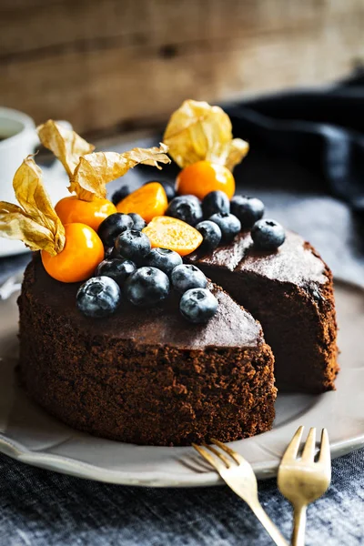 Chocolate cake with Blueberries and Gooseberry on top — Stock Photo, Image