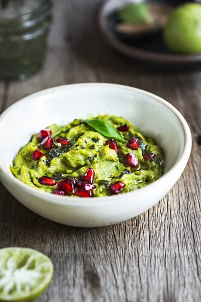 Avocado dip with Basil Olive oil and Pomegranate topping