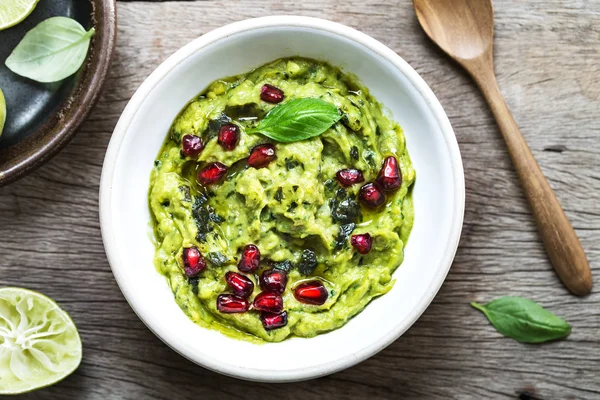 Avocado dip with Basil Olive oil and Pomegranate topping