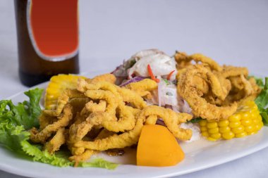 peruvian food: ceviche de pescado con calamar