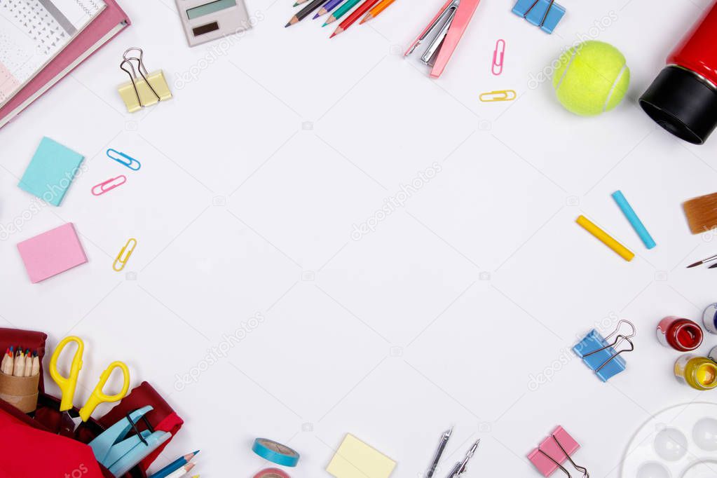 Stationeries and office supplies on white background. Flat lay. Top view with copy space. Back to school concept.