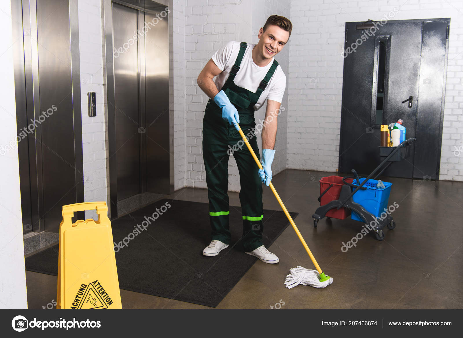 Handsome Young Janitor Mopping Floor Smiling Camera ...