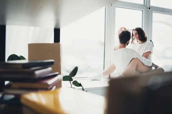 Selective Focus Beautiful Young Couple Hugging Sitting Window Sill Home — Stock Photo, Image