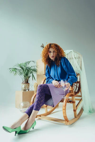 Stylish Redhead Girl Sitting Wicker Chair Wooden Boxes Plant Grey — Stock Photo, Image