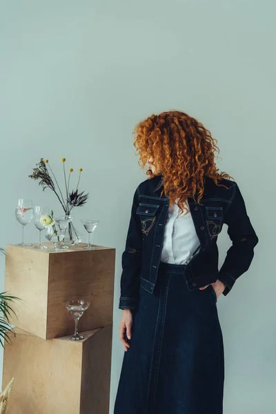 Stylish Redhead Girl Posing Wooden Boxes Glasses Plants Isolated Grey — Stock Photo, Image