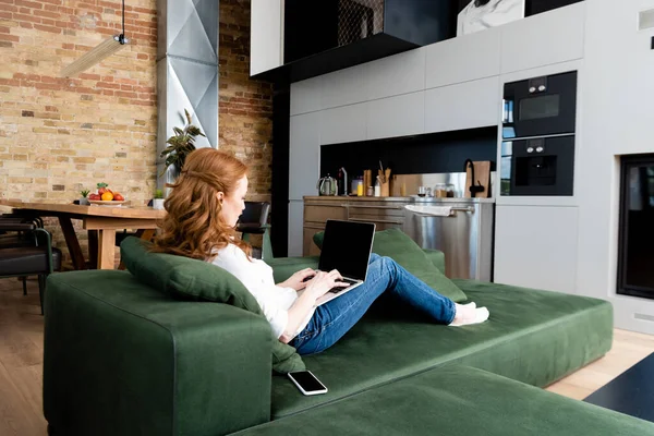 Side View Teleworker Using Laptop Smartphone Couch — Stock Photo, Image