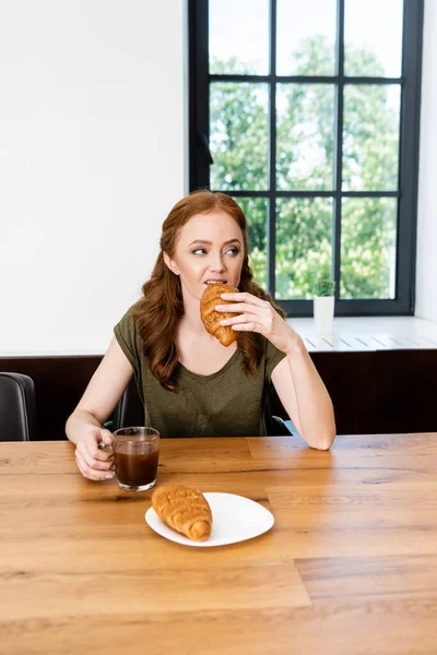 Selective Focus Woman Eating Croissant Holding Coffee Cup Table — Stock Photo, Image