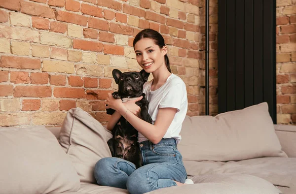 Happy Young Woman Embracing Cute French Bulldog Living Room — Stock Photo, Image