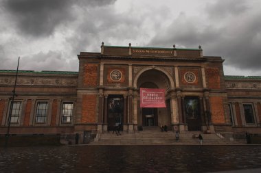COPENHAGEN, DENMARK - APRIL 30, 2020: National Gallery of Denmark with cloudy sky at background  clipart