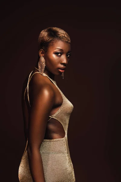 Fashionable african american woman with short hair isolated on brown — Stock Photo