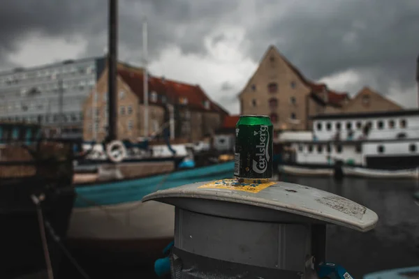 COPENHAGEN, DENMARK - APRIL 30, 2020: Selective focus of can of carlsberg beer on urban street — Stock Photo