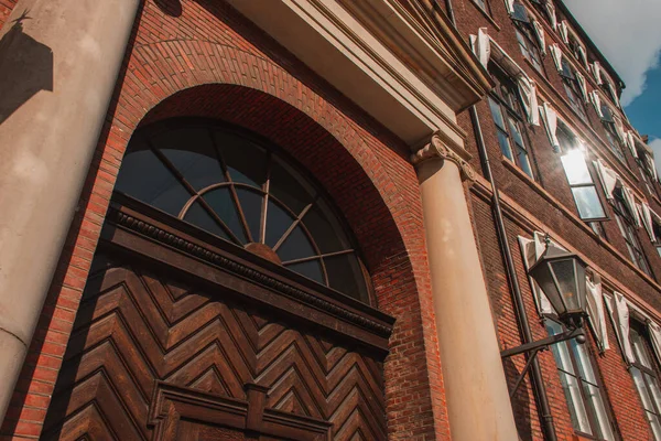 Low angle view of lantern on brick facade of building in Copenhagen, Denmark — Stock Photo