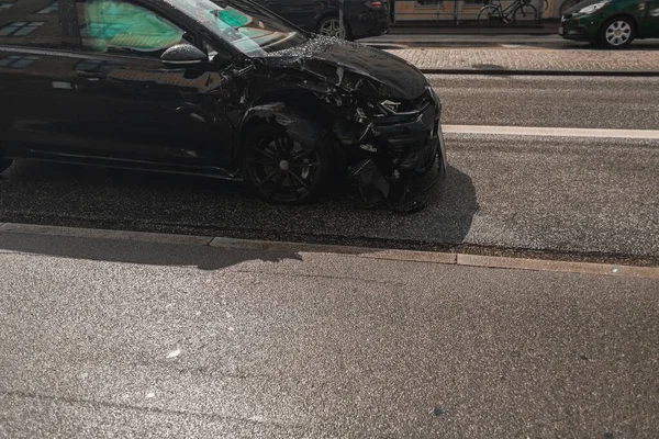 Broken car on road on urban street in Copenhagen, Denmark — Stock Photo