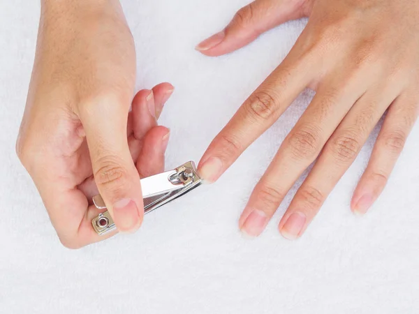 Woman Cutting Nails Using Nail Clipper White Background Health Lifestyle — Stock Photo, Image