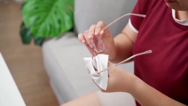 Woman Cleaning His Eyeglasses Microfiber Cloth Sitting Living Room Home — Stock Video