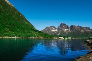 A landscape with a lake and mountains