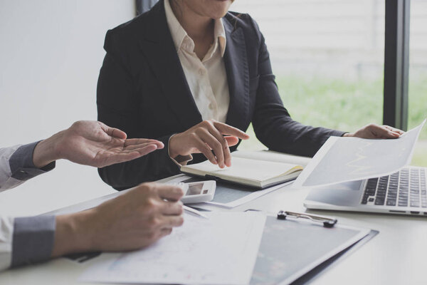 Businessmen are analyzing stock data, male company employees are