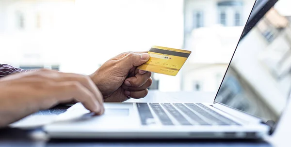 Businessmen use laptop to register online purchases using credit card payments, Convenience in the world of technology and the internet, Shopping online and banking online concept.