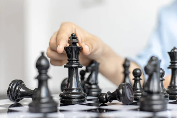 Business people are planning marketing strategies by analyzing the mechanisms and probability of the market by using chess to work, Playing chess for business concept.