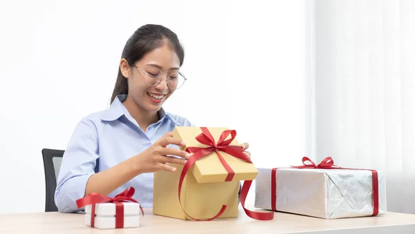 Young Asian girl opened a gift and smiled happily, Birthday surprise, Christmas surprise, New year\'s surprise, Surprise important day.
