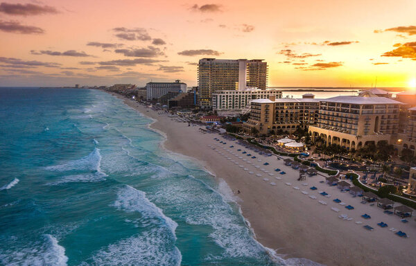 cancun beach at sunset