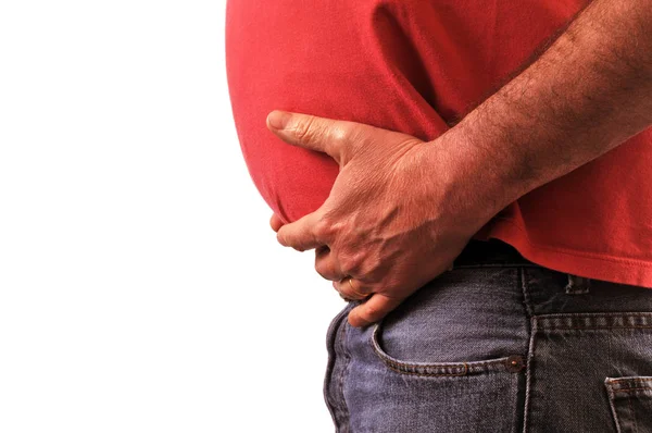 Unrecognizable man with a big belly in close-up on a white background