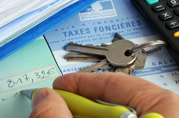 Fill out a check to pay french property taxes