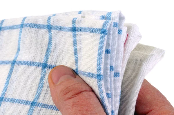 Tea towels in hand close-up on white background