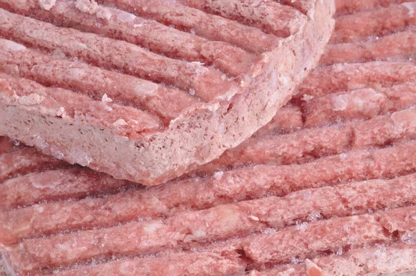 Gefrorene Gehackte Steaks Schließen Hintergrund — Stockfoto