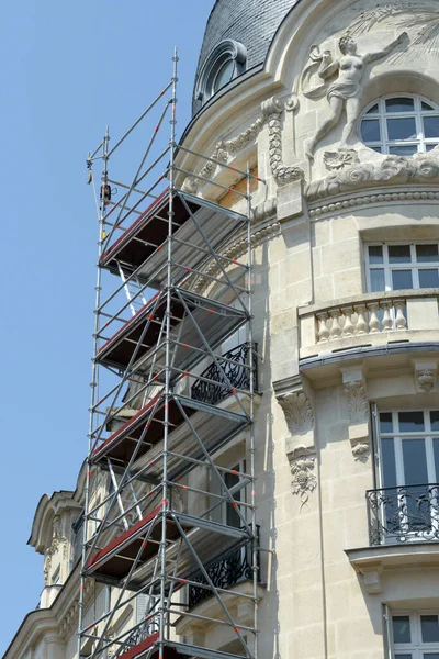 Scaffolding placed on a facade of a building under renovation