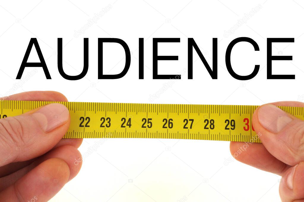 Audience measurement concept close-up on white background 