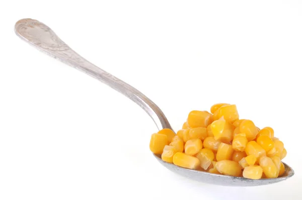 Corn spoon close-up on white background