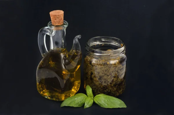 Jar Pesto Sauce Basil Carafe Olive Oil Close Black Background — Stock Photo, Image