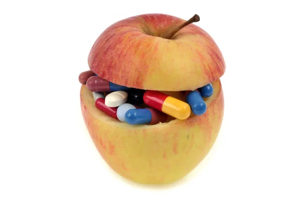 Jablko Naplněné Léky Zblízka Bílém Pozadí — Stock fotografie