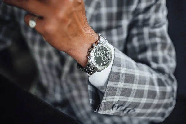 cropped view of man, focus on expensive watch, selective focus