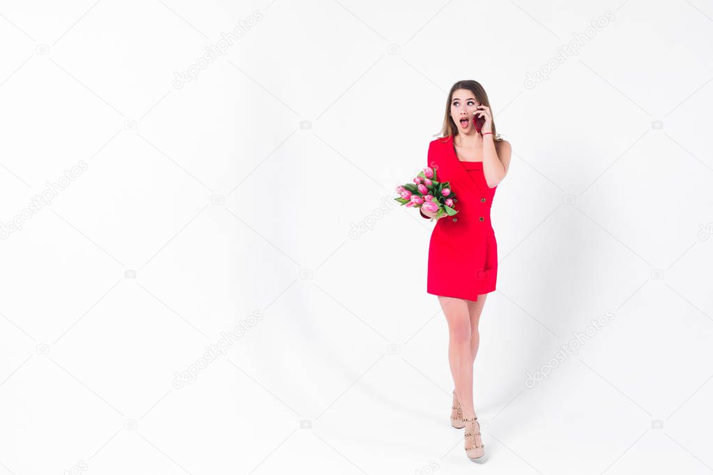 Beautiful woman with bouquet of pink tulips isolated on white background