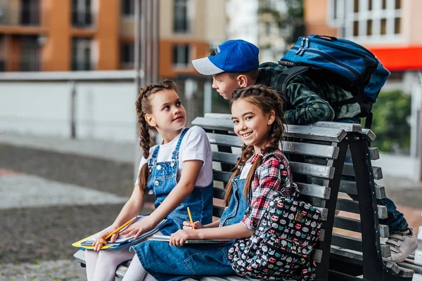 Two Cute Girls Doing Homework Home Small Boy Looking — Stock Photo, Image