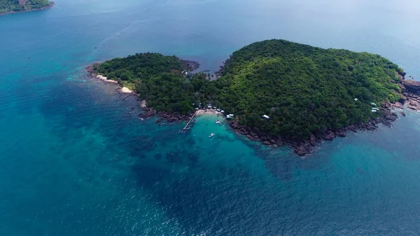 Top view or Aerial view of tropical island jungle with palms and emerald clear water of island .Royalty high quality stock image in Phu Quoc, Kien Giang, Vietnam