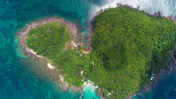 Top view or Aerial view of tropical island jungle with palms and emerald clear water of island .Royalty high quality stock image in Phu Quoc, Kien Giang, Vietnam