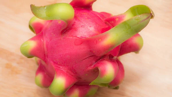 delicious dragon fruit in a cut and completely red and white