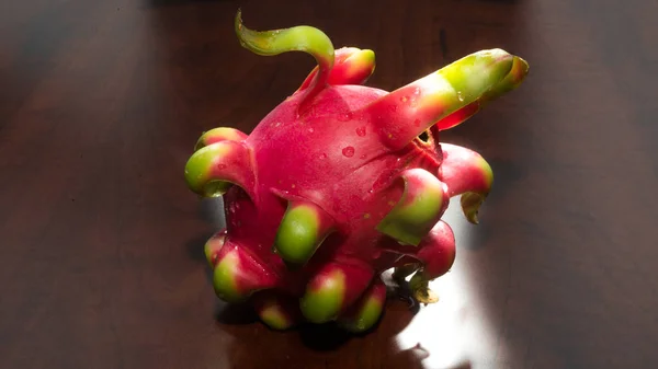 delicious dragon fruit in a cut and completely red and white