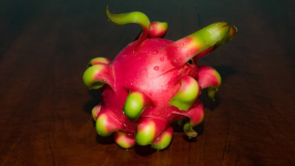 delicious dragon fruit in a cut and completely red and white
